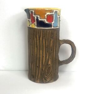 mid century italian pottery pitcher with faux-bois exterior and mosaic style det